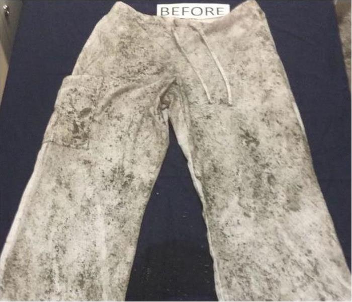 White pants covered in soot