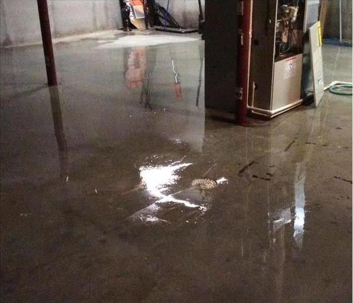 Basement with standing water on the floor 