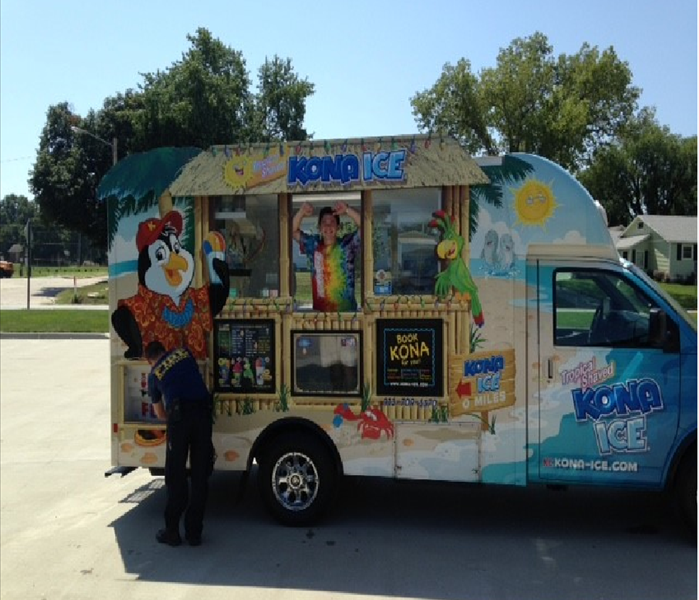 Kona Ice Truck parked in the parking lot of an insurance agency